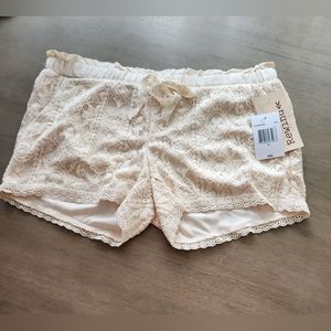 Rewind.  Cream color, lace overlay shorts, size S